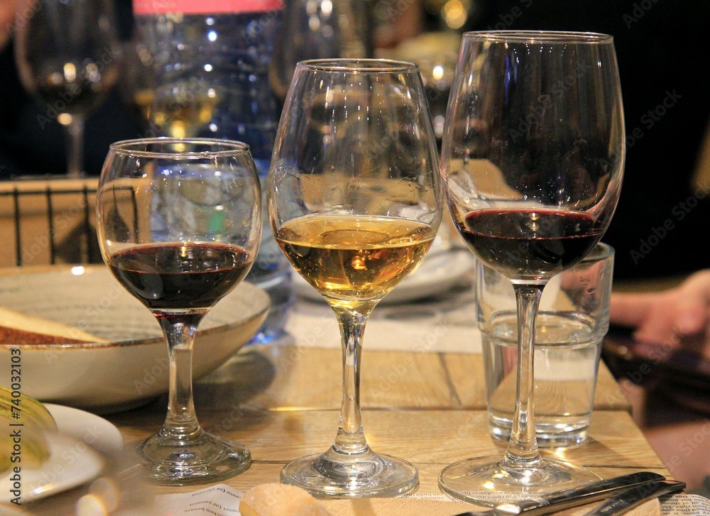 Bottles and glasses of wine. Tasting of sweet Bulgarian wines, Varna (Bulgaria) Bottles and glasses of wine. Tasting of sweet Bulgarian wines, Varna (Bulgaria)