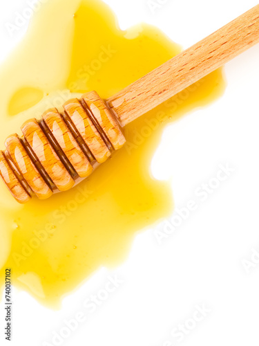 Honey with honey dipper isolated on white background