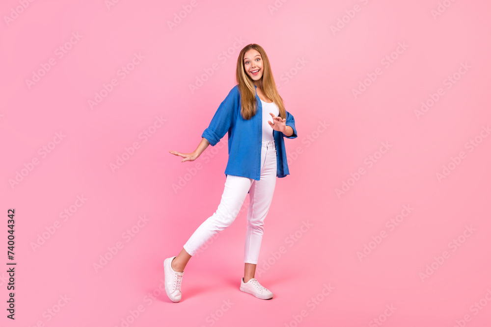Full length photo of carefree sweet lady dressed blue shirt dancing having fun isolated pink color background Full length photo of carefree sweet lady dressed blue shirt dancing having fun isolated pink color background