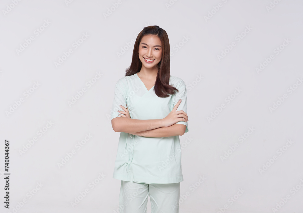 Happy asian woman patient arms crossed isolated on white studio background. life insurance and coverage concept. Happy asian woman patient arms crossed isolated on white studio background. life insurance and coverage concept.