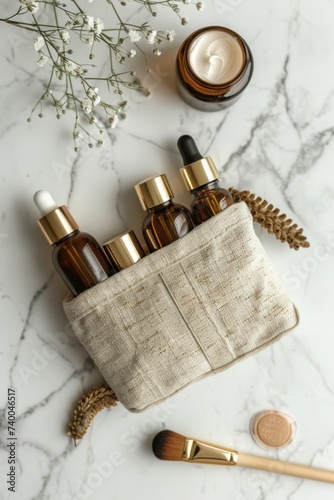 A makeup bag containing natural cosmetic products placed on a marble desk