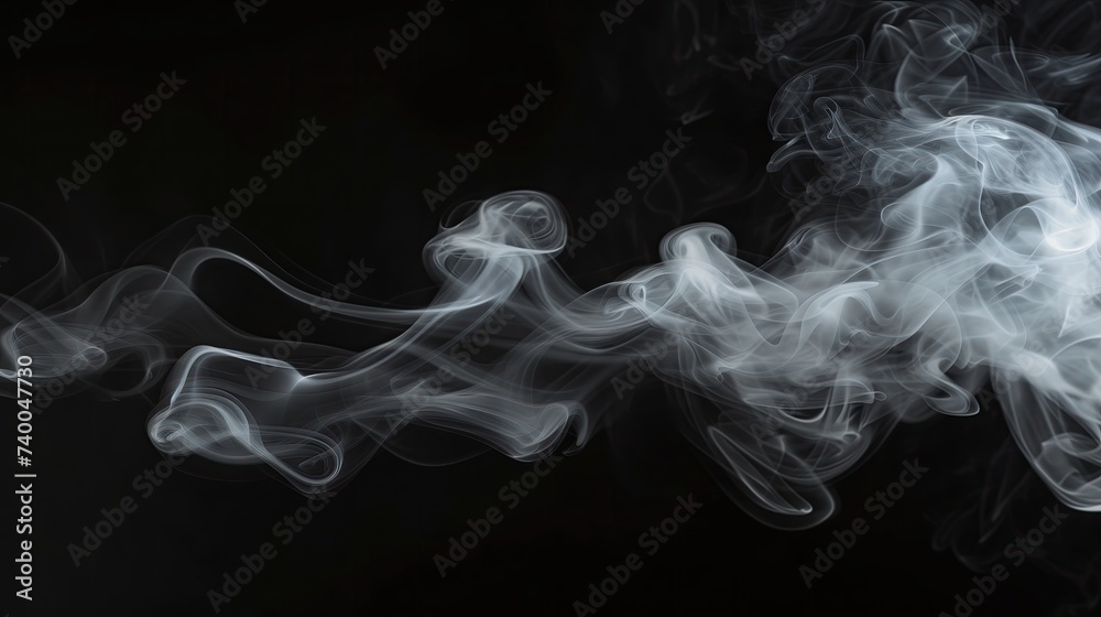 Wispy White Smoke Swirling Gracefully on a Black Background in Low-light Conditions