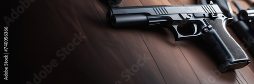 Close up of pistol. Black and White. Shallow depth of field. Copy space banner with a place for text photo