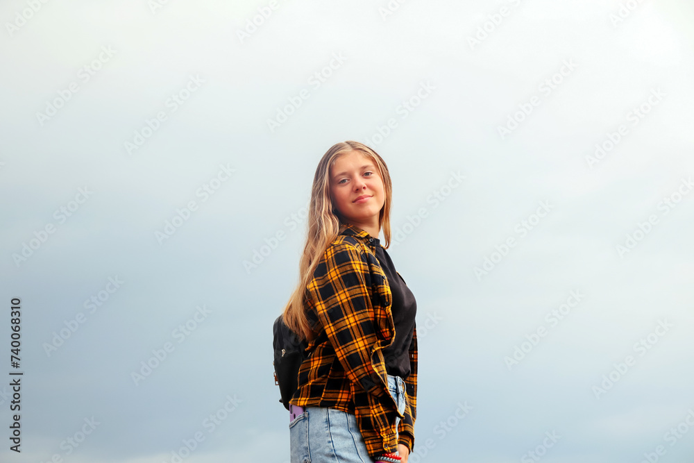 Smiling happy girl. Portrait preteen girl on the gray sky backgr Smiling happy girl. Portrait preteen girl on the gray sky backgr