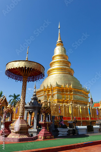 Wat Phra That Haripunchai Woramahawihan. Buddhist stupa under blue sky.