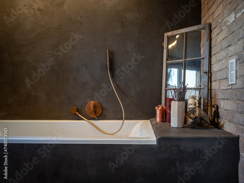 Badezimmer Design mit Betonbeschichtung und Steinen