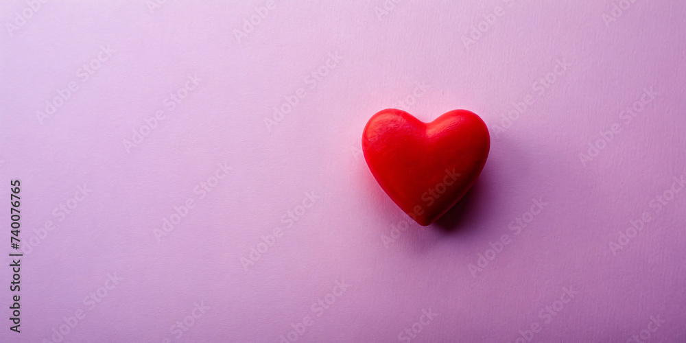 Red heart on purple background, symbolizing love and romance