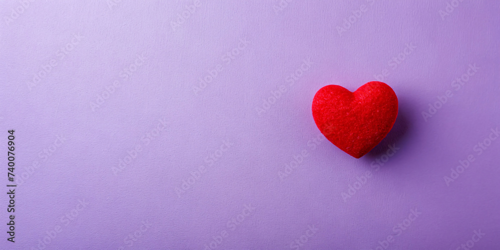 Red heart on purple background, symbolizing love and romance