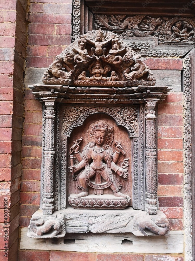 Divine Artistry: A Wooden Carving of a Deity at Mul Chowk Courtyard, Patan Darbar Square, Nepal