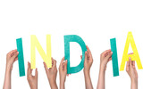 closeup hands people forming India text with colorful letters