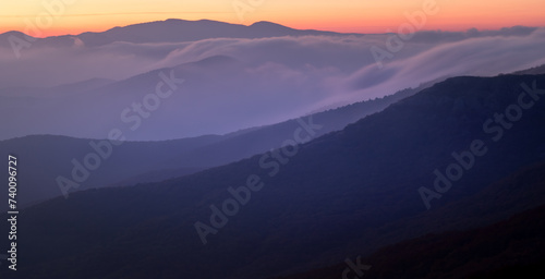 Landscape. Sunset over the mountains with clouds © Aleksey Sagitov
