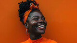 an African girl with dreadlocks and an orange background