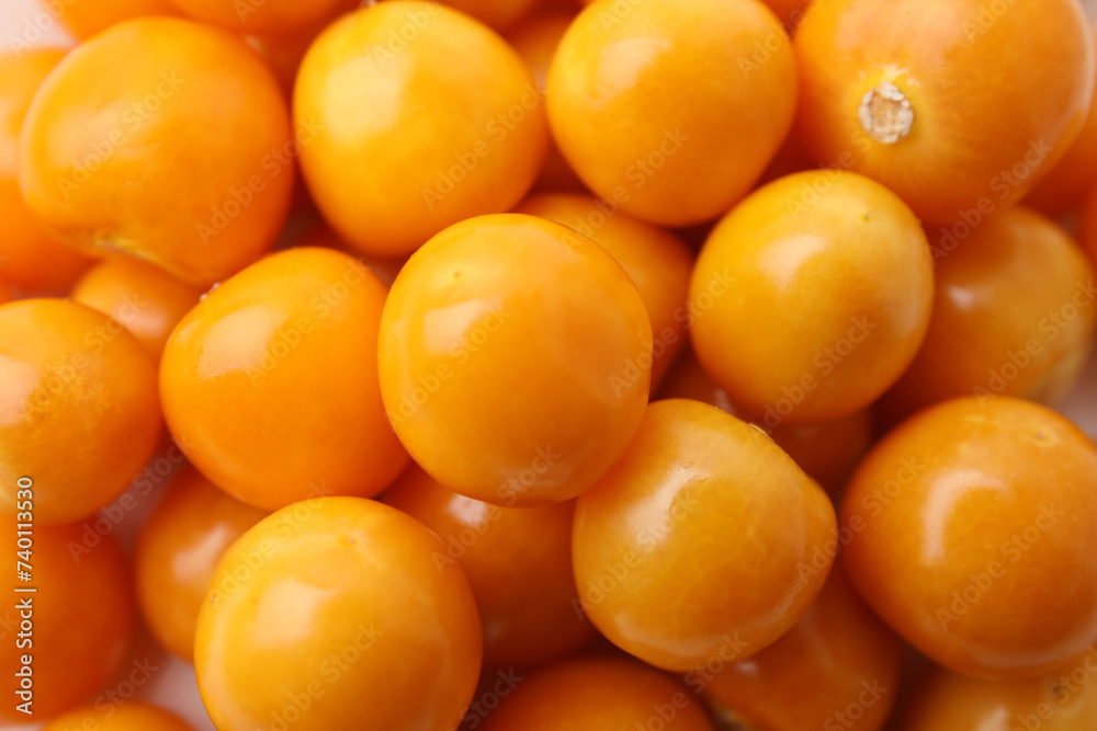 Fresh ripe physalis fruits as background, closeup view Fresh ripe physalis fruits as background, closeup view