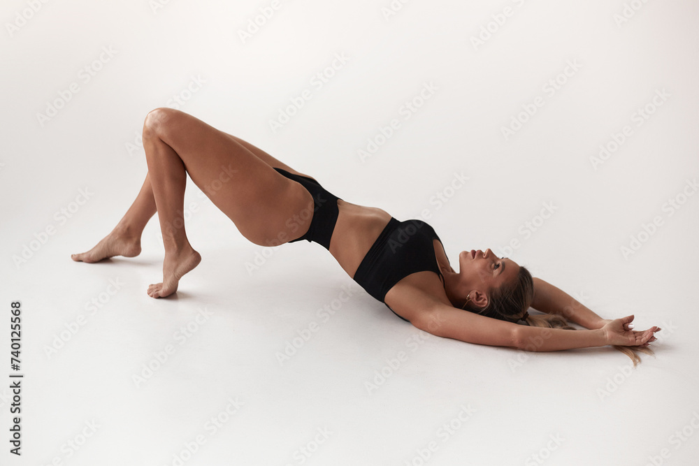 Healthy eating, sports for weight loss. Happy young blonde woman showing a perfect slim body on a white studio background, collage with outlines of an aesthetic figure Healthy eating, sports for weight loss. Happy young blonde woman showing a perfect slim body on a white studio background, collage with outlines of an aesthetic figure