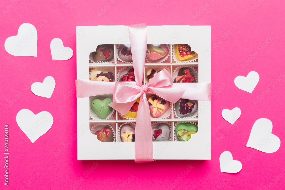 Valentine day composition: sweet candy, with gift boxes with bow and red felt hearts, photo template, background. Top View with copy space Valentine day composition: sweet candy, with gift boxes with bow and red felt hearts, photo template, background. Top View with copy space