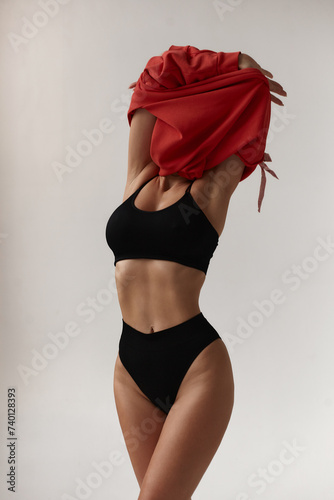 Healthy eating, sports for weight loss. Happy young blonde woman showing a perfect slim body on a white studio background, collage with outlines of an aesthetic figure