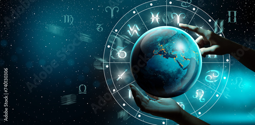 Astrological zodiac signs inside of horoscope with planet Earth in hand. Knowledge of the stars in the sky. The power of the universe concept. Elements furnished by NASA. photo