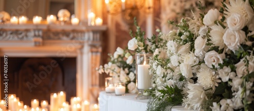 A classic-style wedding ceremony featuring a white floral fireplace adorned with candles  along with a selective focus vertical banner.