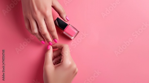 A woman is seen applying nail polish at home, showcasing her elegant manicure...