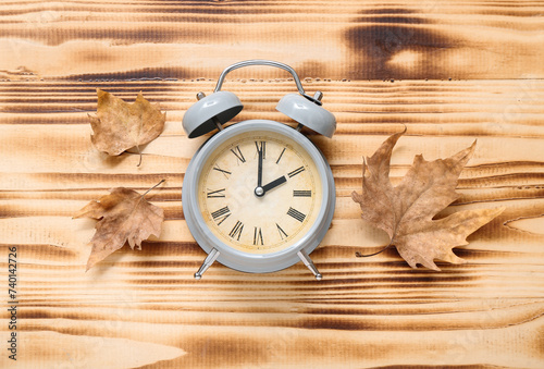 Alarm clock and autumn leav...