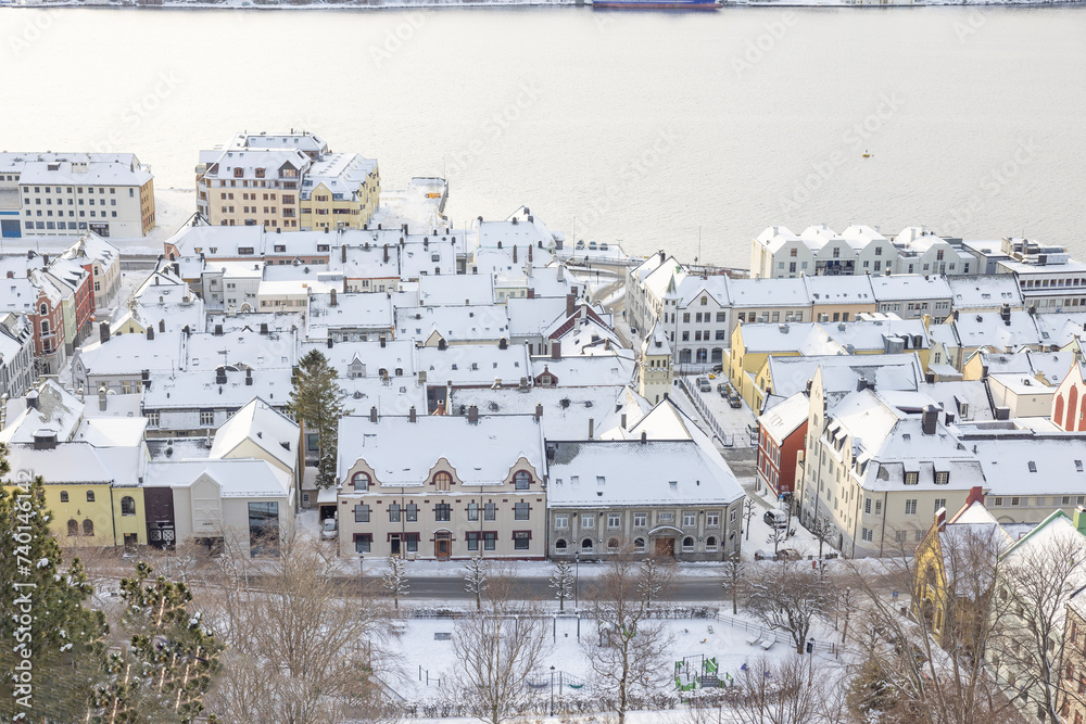Obraz premium The Jugend city Aalesund (Ålesund) harbor on a beautiful cold winter's day. Møre and Romsdal county
