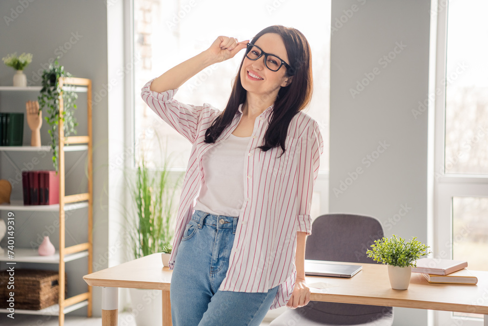 Photo of confident cheerful intelligent company founder girl arm touch eyewear modern bright office room inside