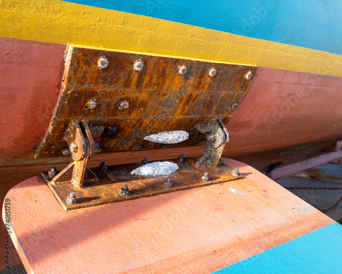 A zinc sacrificial anode on a marine vessel. The anode will dissolve protecting the iron from corrosion.