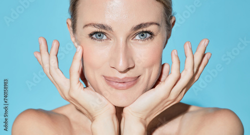 Beauty face concept. Beauty portrait of Caucasian young woman with healthy moisturized facial skin and natural plump lips