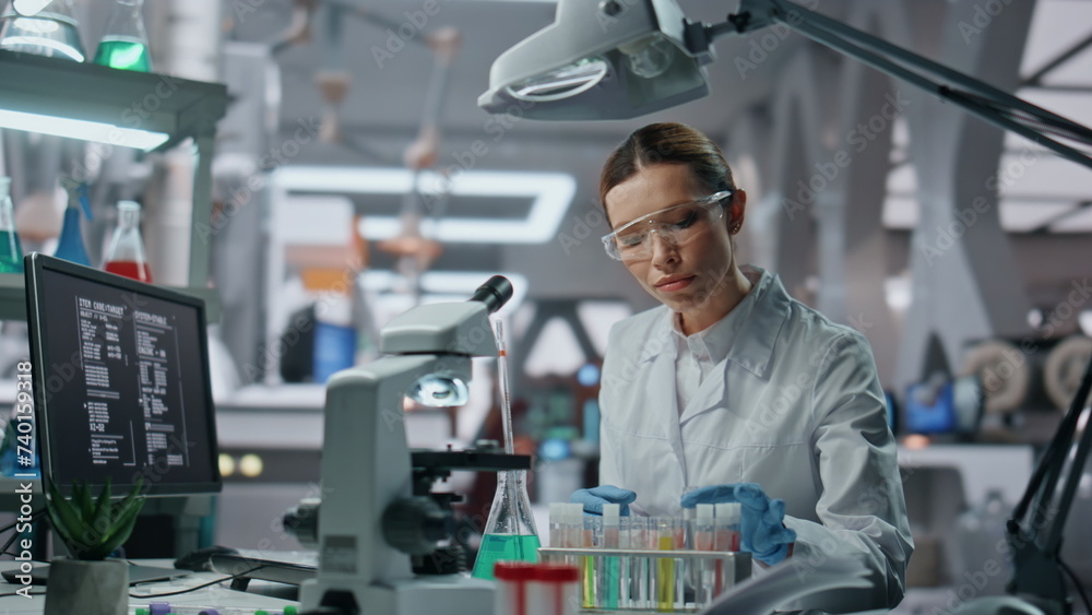Biochemistry specialist checking samples in beaker working in laboratory closeup Biochemistry specialist checking samples in beaker working in laboratory closeup