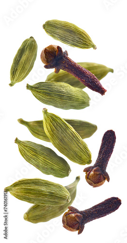 Cardamom and cloves. Flying spices on white background