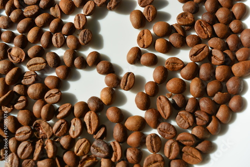 Beautiful brown coffee beans, abika beans, rabusta beans arranged on a white background. photo