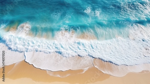 Beach and waves from above. Turquoise water background with top view. Summer seascape from the air.