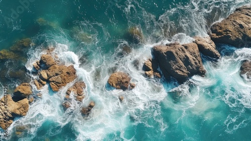 A stunning aerial view of the ocean and rocks. Perfect for travel and nature concepts
