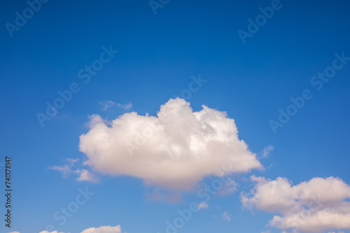 Portrait of a bright fluffy cloud at sky