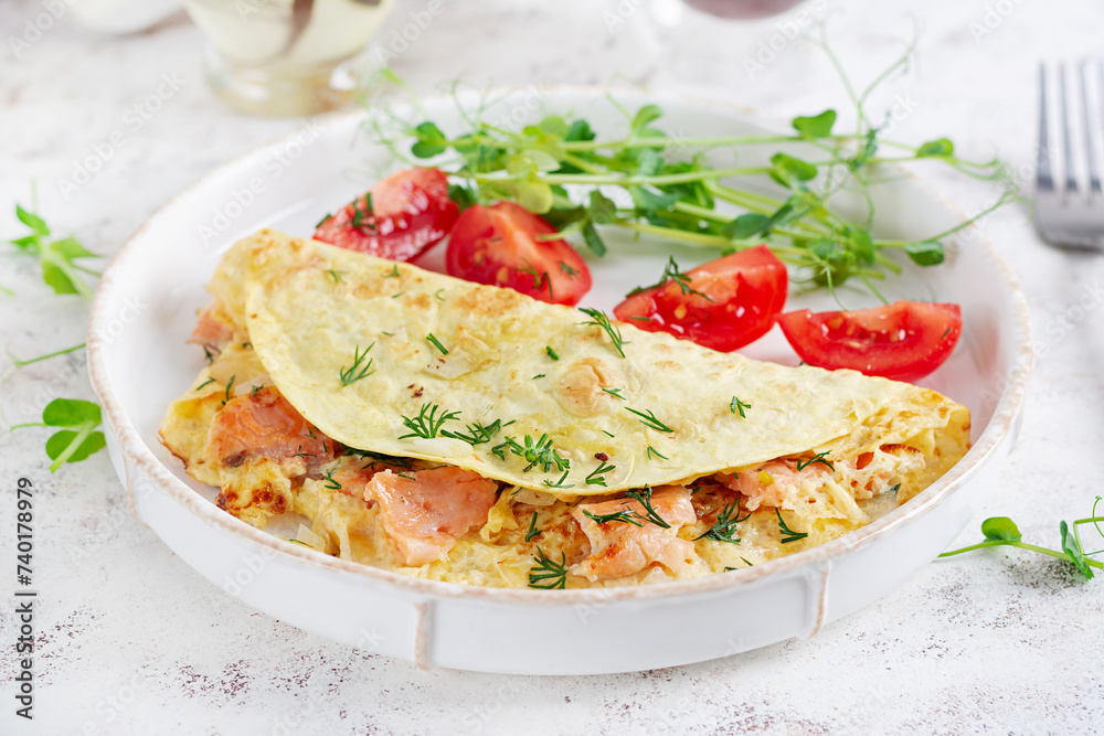 Healthy breakfast. Quesadilla with omelette, salmon and sliced tomatoes. Keto, ketogenic lunch. Healthy breakfast. Quesadilla with omelette, salmon and sliced tomatoes. Keto, ketogenic lunch.