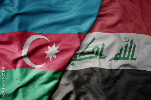 big waving national colorful flag of iraq and national flag of azerbaijan.