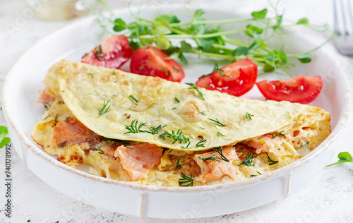 Healthy breakfast. Quesadilla with omelette, salmon  and sliced tomatoes. Keto, ketogenic lunch.