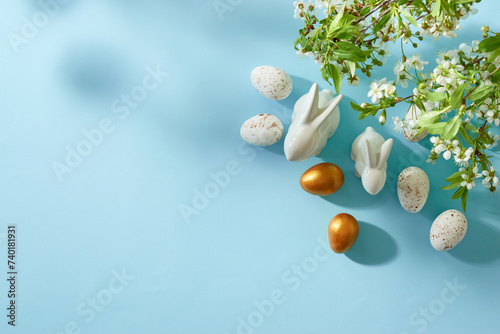 Photography Holiday composition with spring flowers and easter eggs on a blue background