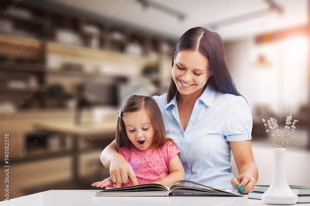 child doing homework with her mom at home. child doing homework with her mom at home.