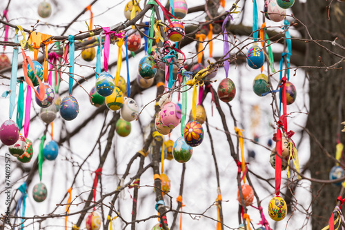Easter tree with eggs. Many colorful multicolored painted easter egg on tree branch, abstract background