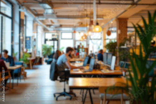 Defocused image of a lively modern co-working area with people and indoor plants. Resplendent. photo