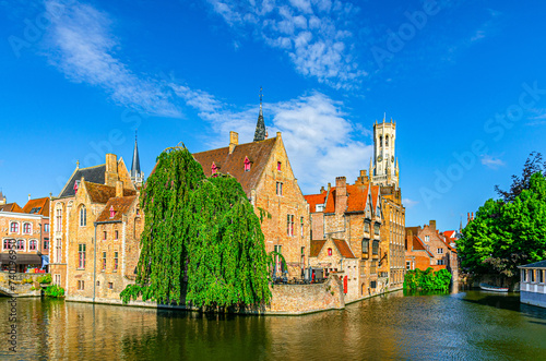 Bruges cityscape, Bruges historical city centre, Rosary Quay Rozenhoedkaai embankment with brick buildings, Belfort Belfry tower, Dijver water canal of Reie river, West Flanders province, Belgium