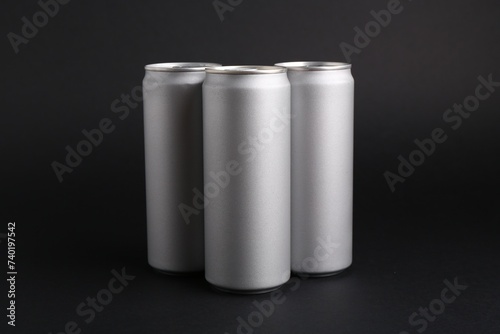 Energy drinks in cans on black background