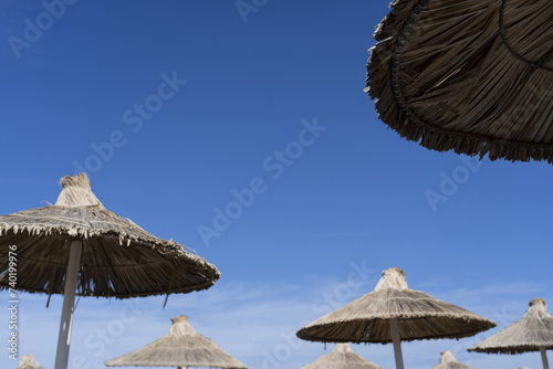 Fototapeta Naklejka Na Ścianę i Meble -  Beach straw umbrellas