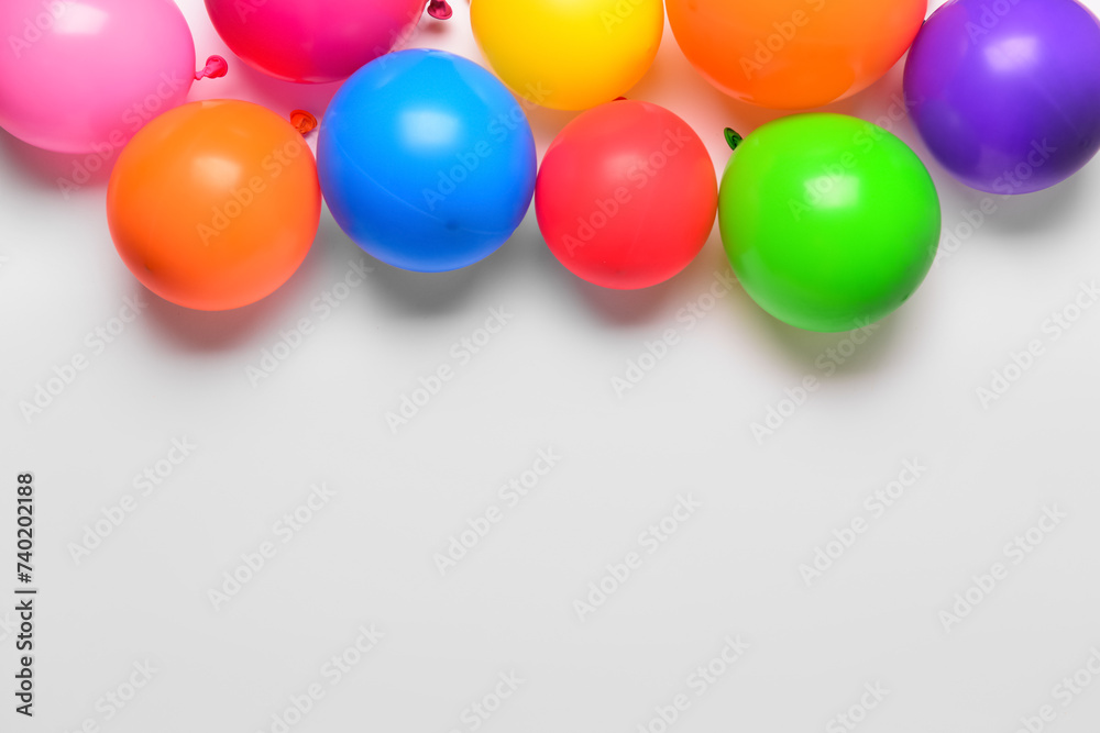 Multicoloured balloons on white background