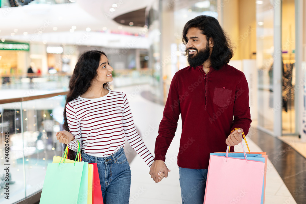 Happy Indian Couple Walking Hand In Hand By Mall Happy Indian Couple Walking Hand In Hand By Mall