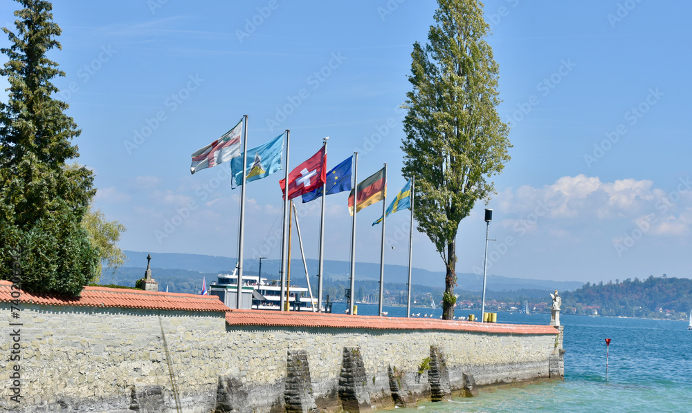 Row of Flags at Mainau Ferry Port in Lake Constance, Germany, Wide Shot