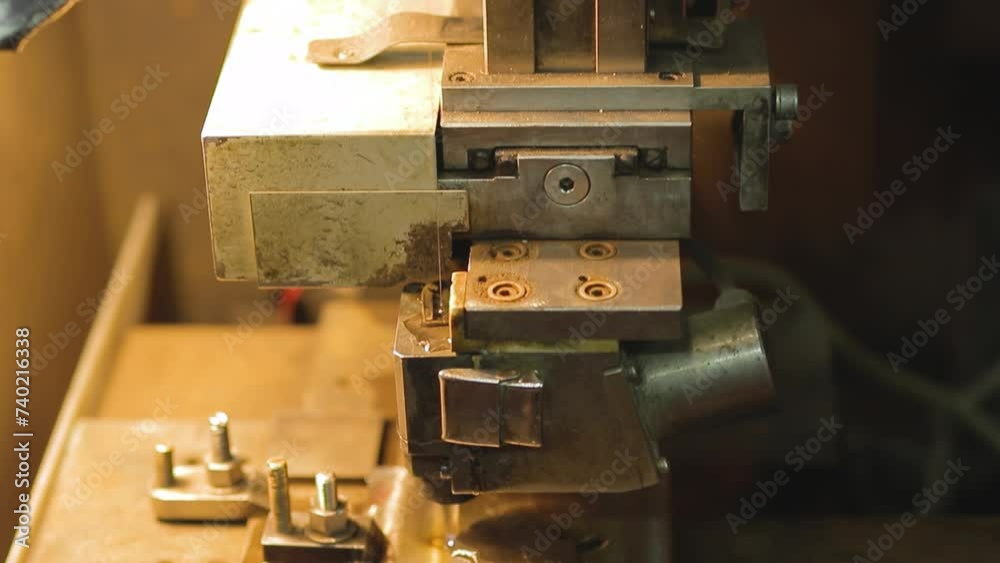 Turners and millers work at machines. The machines are turning out parts. Milling and lathe machines in a workshop in a factory. Turners and millers work at machines. The machines are turning out parts. Milling and lathe machines in a workshop in a factory.