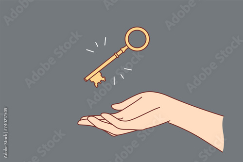 Golden key over woman hand to open safe with money or door to own house bought with mortgage