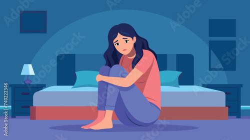 Lonely Woman Sitting on the Floor in Her Bedroom at Night